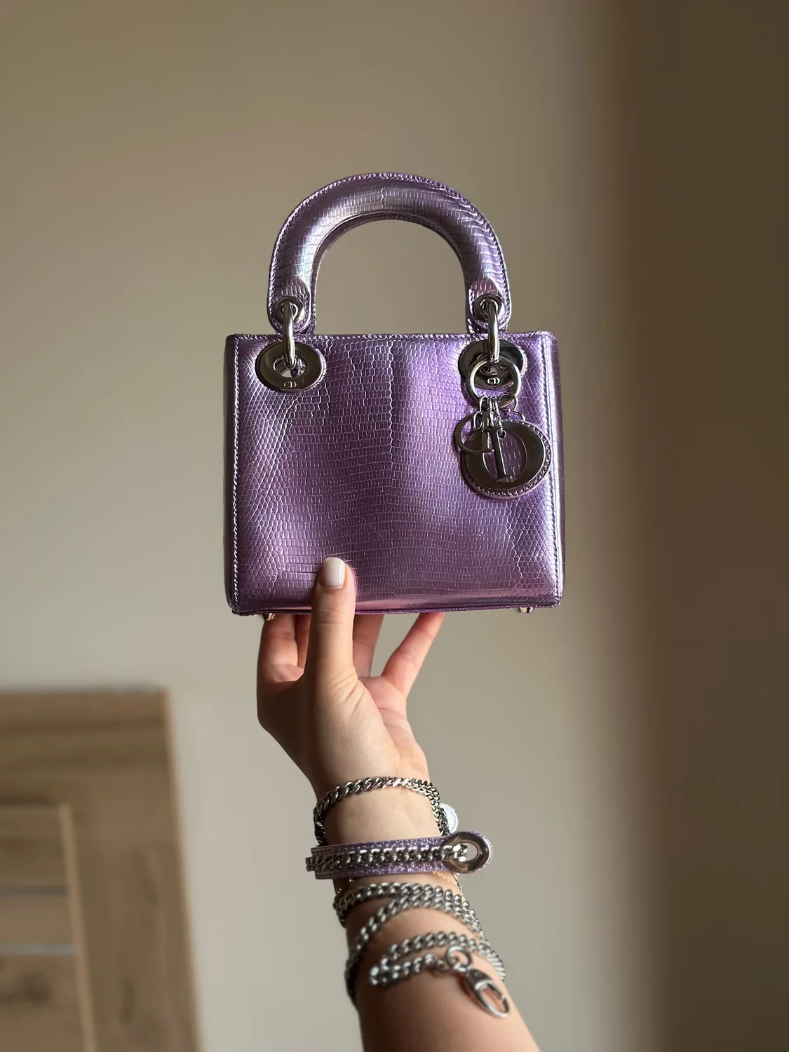Metallic purple designer handbag